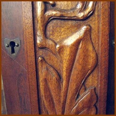Close-up heart shaped escutcheon & relief carving.